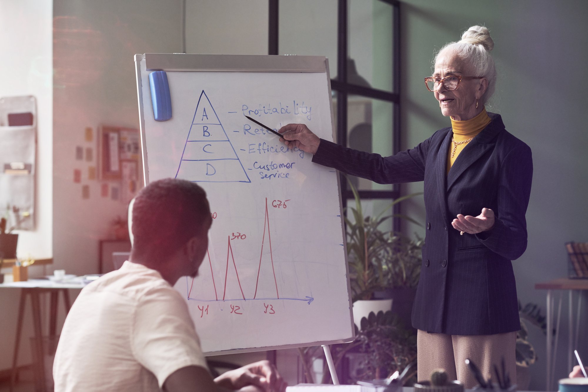 senior-woman-leading-business-presentation-in-mode-2025-03-13-18-57-42-utc_edit